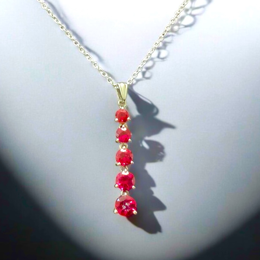 925 sterling silver pendant with sparkling red crystals.